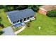 Aerial view of a well maintained home with a spacious yard and welcoming front porch at 4914 Ridgeley Dr, Charlotte, NC 28208
