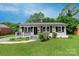 Charming single-story house with a well-manicured lawn and inviting front porch at 4914 Ridgeley Dr, Charlotte, NC 28208