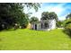 Charming home with a lush front yard, white exterior, and inviting porch, perfect for relaxation at 4914 Ridgeley Dr, Charlotte, NC 28208