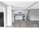 Well-lit kitchen with stainless steel appliances, white cabinetry, and view to the hallway at 4914 Ridgeley Dr, Charlotte, NC 28208