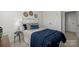 Charming bedroom featuring a plush bed with navy accents, a dresser, and neutral-toned walls at 5004 Cherry Gum Ct # 43, Matthews, NC 28105