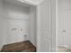 Walk-in closet with wooden floors, a door to the rest of the house, and a wire rack at 5004 Cherry Gum Ct # 43, Matthews, NC 28105