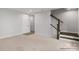 Finished basement with neutral carpet and stairwell access at 5030 Grain Orchard Rd # 3025C, Indian Trail, NC 28079