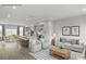 Open-concept living room features hardwood floors, neutral decor, and lots of light at 5030 Grain Orchard Rd # 3025C, Indian Trail, NC 28079