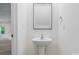 Half bathroom with modern fixtures and pedestal sink at 6322 Sydney Mae Ln, Charlotte, NC 28262