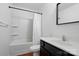 Bathroom featuring a single vanity, shower/bath, white curtain, and hardwood-look flooring at 6322 Sydney Mae Ln, Charlotte, NC 28262