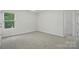 Neutral bedroom with carpet and a window with natural light at 6322 Sydney Mae Ln, Charlotte, NC 28262