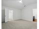 Bright bedroom featuring neutral carpet, ceiling fan, and a view into an ensuite bathroom at 6322 Sydney Mae Ln, Charlotte, NC 28262