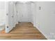 Inviting foyer featuring hardwood floors, a neutral color palette, and an arched entryway at 6322 Sydney Mae Ln, Charlotte, NC 28262