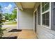 Inviting front entrance with gray siding, offering curb appeal and a welcoming feel at 6322 Sydney Mae Ln, Charlotte, NC 28262
