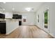 Eat-in kitchenette area with breakfast bar, light walls, and exterior access at 6322 Sydney Mae Ln, Charlotte, NC 28262