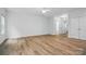 Bright living room with modern flooring, neutral paint, and natural light at 6322 Sydney Mae Ln, Charlotte, NC 28262