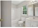 Bright bathroom with a combined shower and tub, vanity, and ample natural light at 6332 Sackett Way, Charlotte, NC 28269