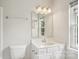 A bright bathroom features a vanity with storage, a sink and a window for natural light at 6332 Sackett Way, Charlotte, NC 28269