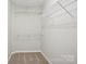 A well-organized walk-in closet featuring wire shelving to maximize storage at 6332 Sackett Way, Charlotte, NC 28269