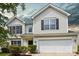 Charming two-story home with white siding, black shutters, and a two-car garage at 6332 Sackett Way, Charlotte, NC 28269