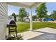 Cozy front porch view with a grill and a glimpse of the neighborhood at 6332 Sackett Way, Charlotte, NC 28269