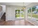 Eat-in kitchen area featuring a sliding glass door, pendant lighting, and natural light at 6332 Sackett Way, Charlotte, NC 28269