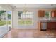 Eat-in kitchen with stainless appliances, ample cabinets, and a sliding door to the patio at 6332 Sackett Way, Charlotte, NC 28269