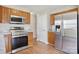 Efficient kitchen featuring stainless appliances, light wood cabinets, and a modern design at 6332 Sackett Way, Charlotte, NC 28269
