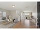 Bright living room features stylish decor, wood flooring, and an open layout with ample natural light at 6332 Sackett Way, Charlotte, NC 28269