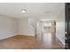 Spacious living area with wood floors, offering an open layout and stairs to the upper level at 6332 Sackett Way, Charlotte, NC 28269