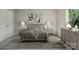Serene bedroom with neutral tones, featuring a king-size bed and coordinated decor at 6332 Sackett Way, Charlotte, NC 28269
