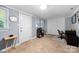 Versatile room with neutral carpet, a closet, a desk area, and access to an exterior door at 653 Turner St, Mooresville, NC 28115
