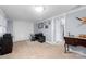 Versatile room featuring a large closet, a desk area, and neutral carpet, ideal for a bedroom or office at 653 Turner St, Mooresville, NC 28115