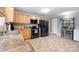 Modern kitchen featuring stainless steel appliances and light wood cabinets, offering ample storage and counter space at 653 Turner St, Mooresville, NC 28115