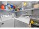 Laundry room with washer, dryer, and wire shelving at 653 Turner St, Mooresville, NC 28115