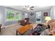 Bright living room with a comfortable recliner, a decorative fireplace, and natural light from large windows at 653 Turner St, Mooresville, NC 28115