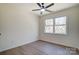 Bright and airy bedroom with a ceiling fan and large window that brings in natural light at 709 Catawba St, Lincolnton, NC 28092