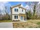 Charming two-story home with a light blue front door and manicured landscaping at 709 Catawba St, Lincolnton, NC 28092