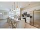 Modern open-concept kitchen with stainless steel appliances, quartz countertops, and island seating at 709 Catawba St, Lincolnton, NC 28092