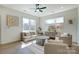 Spacious living room with large windows, comfortable seating, and a contemporary design at 709 Catawba St, Lincolnton, NC 28092