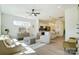 Bright, open-concept living room with modern furniture and hardwood floors that flows into the kitchen area at 709 Catawba St, Lincolnton, NC 28092