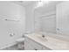 Bright bathroom with single sink vanity and a large mirror at 7212 Ravanna Dr, Charlotte, NC 28213