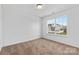 This bedroom has neutral carpeting and a window to let in natural light at 7212 Ravanna Dr, Charlotte, NC 28213