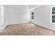 A spacious bedroom with neutral carpet and ample natural light at 7212 Ravanna Dr, Charlotte, NC 28213