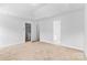 Large bedroom with plush carpet, neutral walls, and two windows at 7212 Ravanna Dr, Charlotte, NC 28213