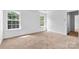Bright and airy bedroom with large windows, neutral walls and carpet at 7212 Ravanna Dr, Charlotte, NC 28213