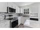 Stylish kitchen with stainless steel appliances, granite countertops, and ample cabinet space at 7212 Ravanna Dr, Charlotte, NC 28213