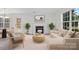 Living room with modern decor, a cozy fireplace, and a bright, inviting atmosphere at 7212 Ravanna Dr, Charlotte, NC 28213