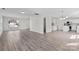 Bright living room with wood-look flooring and large windows allowing natural light at 7212 Ravanna Dr, Charlotte, NC 28213