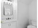 Charming powder room with sleek vanity, modern fixtures, and toilet at 7212 Ravanna Dr, Charlotte, NC 28213