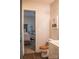 Neutral bathroom featuring a toilet and vanity, with a view into a bedroom at 7691 Red Robin Trl, Denver, NC 28037