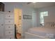 Cozy bedroom featuring a double bed, dresser, and ensuite bathroom at 7691 Red Robin Trl, Denver, NC 28037