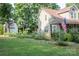 Home with a large yard, American flag, and outbuilding, blending comfort and country charm at 7691 Red Robin Trl, Denver, NC 28037