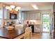 Bright kitchen with stainless steel appliances, ample counter space, and a dining area at 7691 Red Robin Trl, Denver, NC 28037